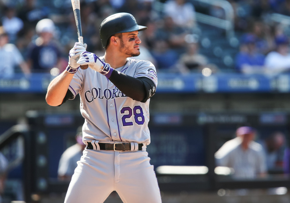 Rockies' Nolan Arenado, dealing with sore left shoulder, sits